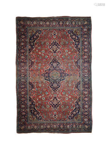 A Kashan Kurk rug, Central Persia, the madder field with an indigo lobed pole medallion,