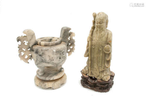 A Chinese carved soapstone figure of Shou Lao, 19th century, the immortal bearing a staff and peach,