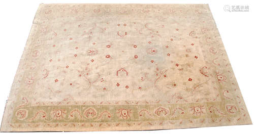 A Ziegler carpet, the ivory field with an all over design of flowering vines and palmettes,