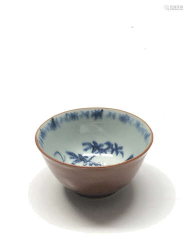 A Chinese porcelain tea bowl, with cafe-au-lait glazing to the outside,