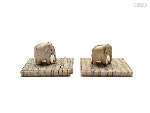 A pair of carved ivory paperweights in the form of elephants, circa 1900,