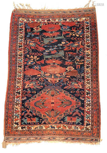 An Afshar rug, South West Persia, the iundigo field with a lozenge medallion, birds,