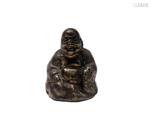 A Chinese gilt bronze scroll weight, Qing period, in the form of a seated buddha, height 4.