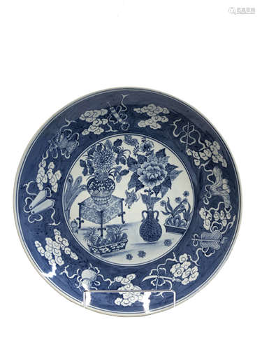 A Chinese blue and white porcelain charger, decorated with vases of flowers,