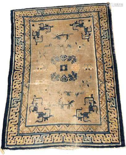 An early Chinese rug, the muted gold field with a circular floral medallion, leafy vines and moths,