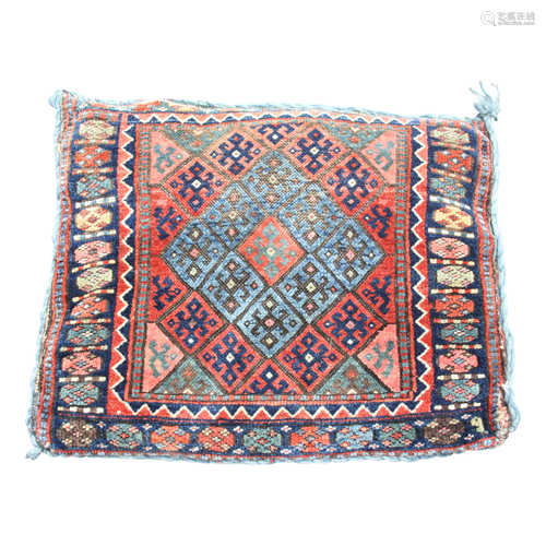 A Jaff bag pillow, with rows of polychrome lozenge hooked guls,