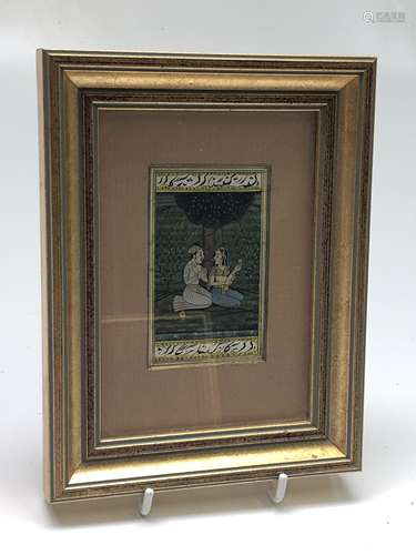 A miniature Indian painting, of a couple seated beneath a tree, calligraphy to borders, 8 x 5cm.