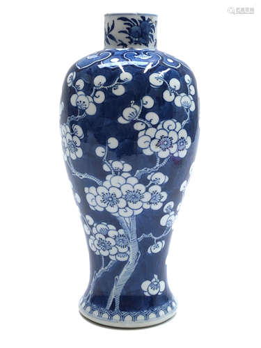 A Chinese blue and white prunus blossum baluster vase, circa 1900, with four character Kangxi mark,