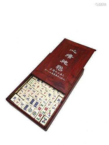 A Chinese mahjong set, early 20th century, with bamboo and ivory tiles,