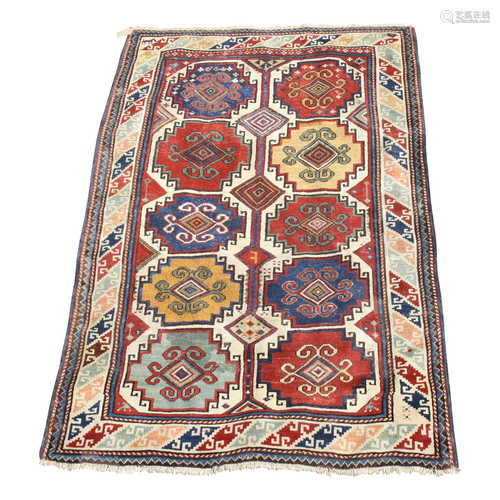 A Kazak rug, South West Caucasus, with five rows of two hooked polychrome medallions,