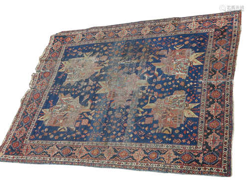 An Afshar rug, South West Persia, the indigo field with five polychrome medallions with guls, vines,