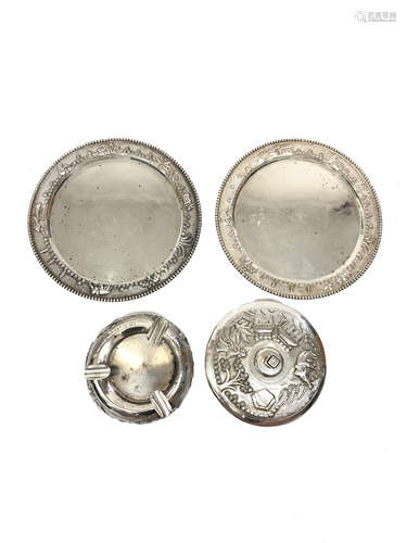 A pair of Indian silver plates, repousee decorated with village scenes, diameter 16.