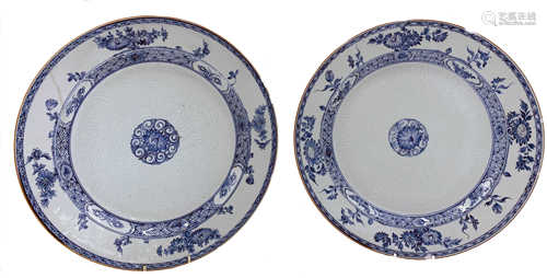 A near pair of Chinese porcelain blue and white plates, 18th century, each with floral sprays,