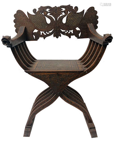 A Syrian savanarola brass inlaid armchair, 19th century, the back carved with peacocks,