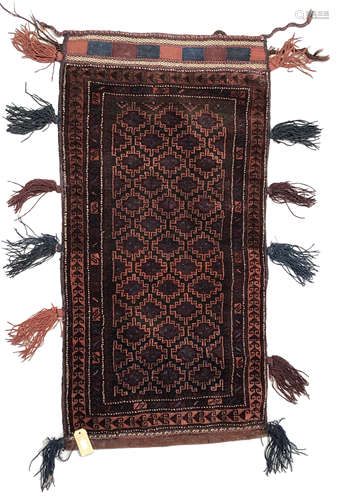 A Belouch Balisht tent bag, the charcoal field with rows of hooked guls within three borders,