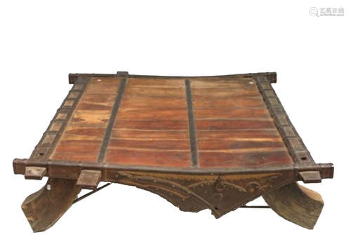 An Indian carved hardwood low table, with iron mounts, height 38cm, width 136cm, depth 134cm.