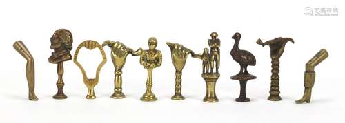 Ten antique pipe tampers including Napoleon, Shakespeare, jockey and leg design examples, the