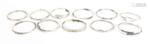 Eleven silver coloured metal bangles some marked 925, approximate weight 134.4g : For Further