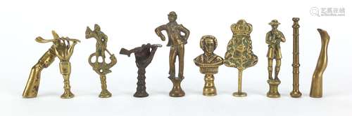 Ten antique pipe tampers including Bonnie Prince Charlie, figural and leg design examples, the