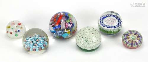 Six colourful glass paperweights including Millefiori and Perthshire examples, the largest 7.5cm