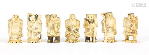 Seven Japanese carved ivory Okimono's including two of farmers, one with character marks to the