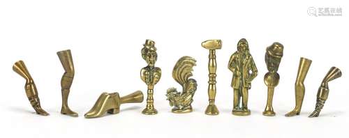 Ten antique pipe tampers including boot, leg, cockerel and figural design examples, the largest 6.