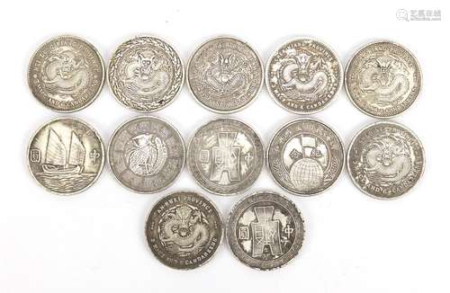 Twelve Chinese silver coloured metal coins : For Further Condition Reports and Live Bidding Please