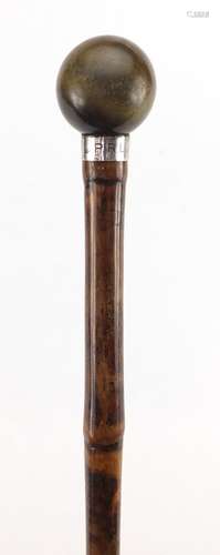 Bamboo walking stick with horn pommel and silver collar by Brigg of London, the pommel possibly