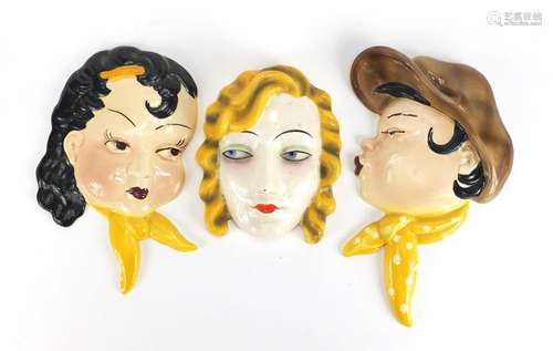 Art Deco hand painted face mask of a female and a pair of Flacon Ware examples, the largest 24cm