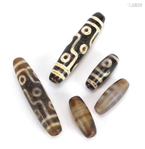 Five Islamic agate beads, the largest 6cm in length : For Further Condition Reports Please Visit Our