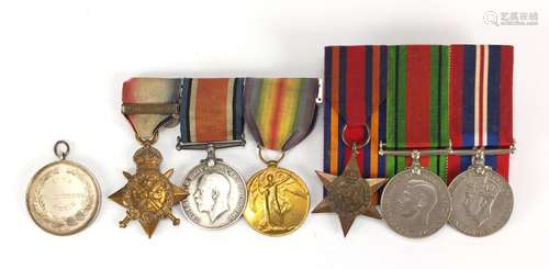 British Military World War I and World War II medal group and a silver medallion including a trio