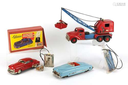 Vintage toys including a Schuco electric car with box, numbered 5380U, German tinplate clockwork car