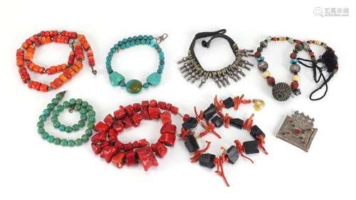 Middle Eastern jewellery including coral and stone necklaces and silver coloured metal bracelet :