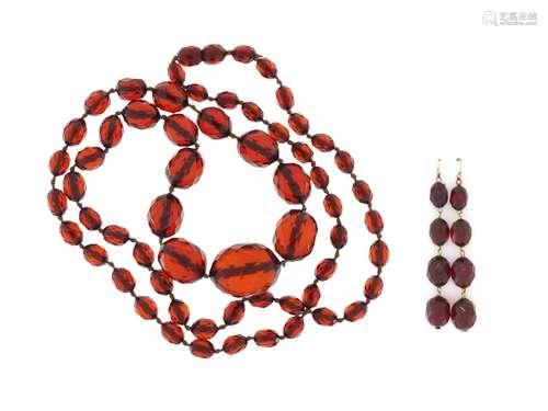 Amber coloured faceted bead necklace with earrings, the necklace 84cm in length, approximate