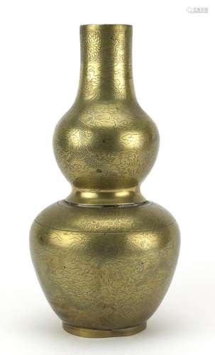 Chinese bronze double gourd vase, engraved with dragons chasing the flaming pearl amongst clouds,