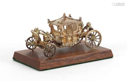 Miniature silver Coronation coach by Toye, Kenning & Spencer Ltd, with fitted box, 7cm in length :