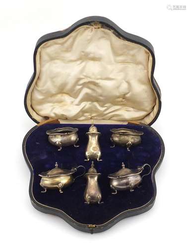 Silver six piece cruet, by Walker & Hall Sheffield 1904, housed in a fitted tooled leather box,