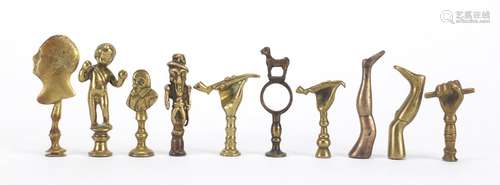 Ten antique pipe tampers including Shakespeare, putti and leg design examples, the largest 7.5cm