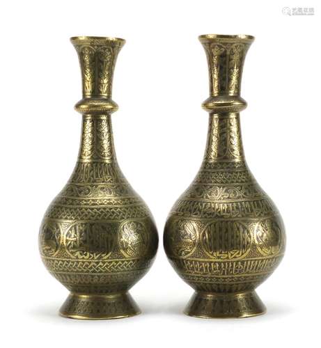 Pair of 19th century Persian bronze vases, engraved with script, animals and flowers, each 30cm high