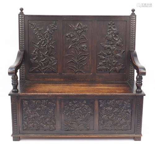 Oak Settle with floral carved panels and lift up seat, 122cm H x 123cm W x 46cm D : For Further