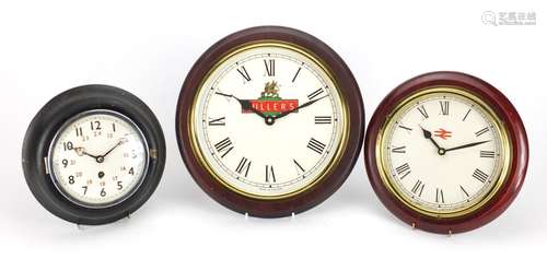 Three wall clocks comprising British Rail, Abbey Clock Co and Fuller's Brewery examples, the largest