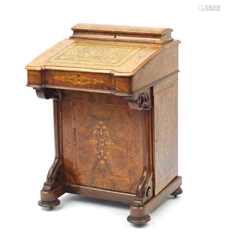 Victorian inlaid walnut davenport, the lift lid with tooled leather insert above a panel door,