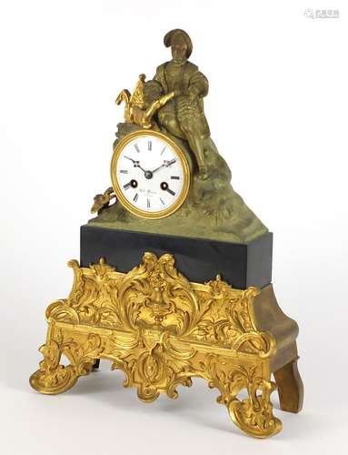 19th century French ormolu mantel clock, mounted with a man his dog, the enamelled dial with Roan