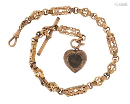 Victorian 9ct rose gold watch chain with gilt metal love heart locket, the chain 30cm in length,