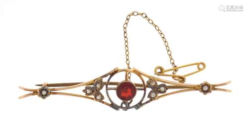 Art Nouveau 9ct gold seed pearl and garnet bar brooch, 6.5cm in length, approximate weight 3.9g,