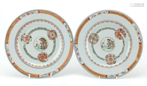 Pair of Chinese porcelain plates, each hand painted with a central roundel enclosing a landscape