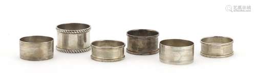 Six silver napkin rings, some with engine turned decoration, various hallmarks, approximate weight