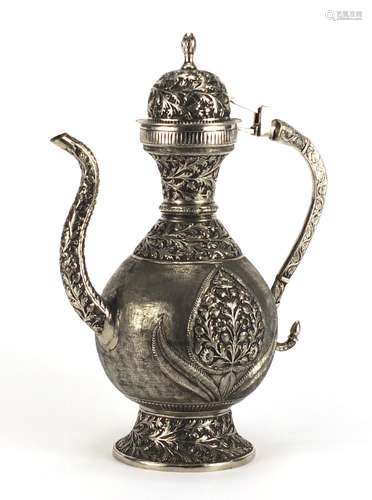 Indian silver coloured metal water jug cast with stylised flowers, 35.5cm high, approximate weight