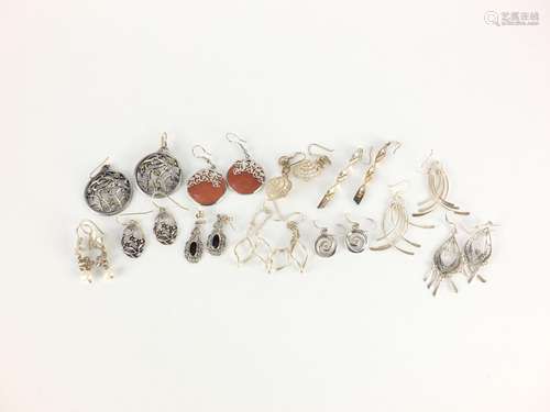 Eleven pairs of silver and white metal earrings, some set with semi precious stones, approximate