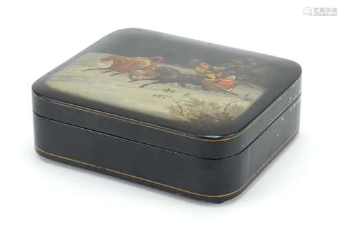 Russian black lacquered box by Fedoskino, the hinged lid hand painted with figures in a sleigh,